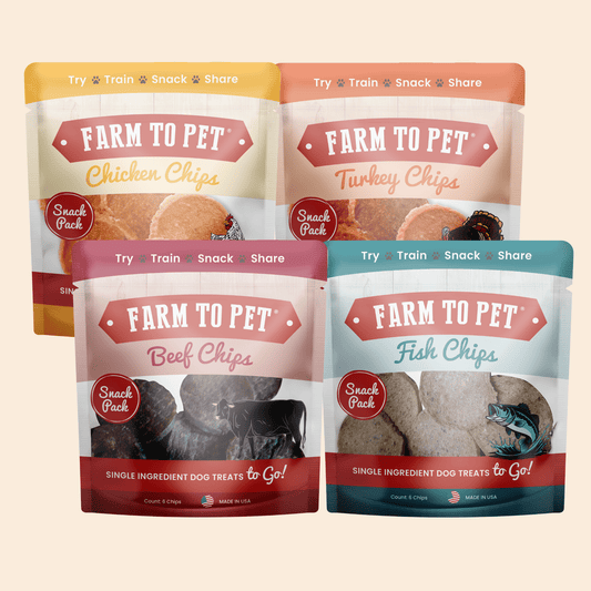 Four packages of 'Farm to Pet' dog treat snacks on a beige background