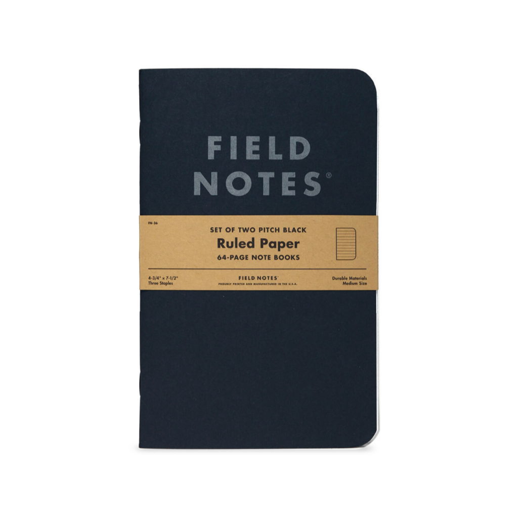 Black notebook with 'Field Notes' branding on a white background