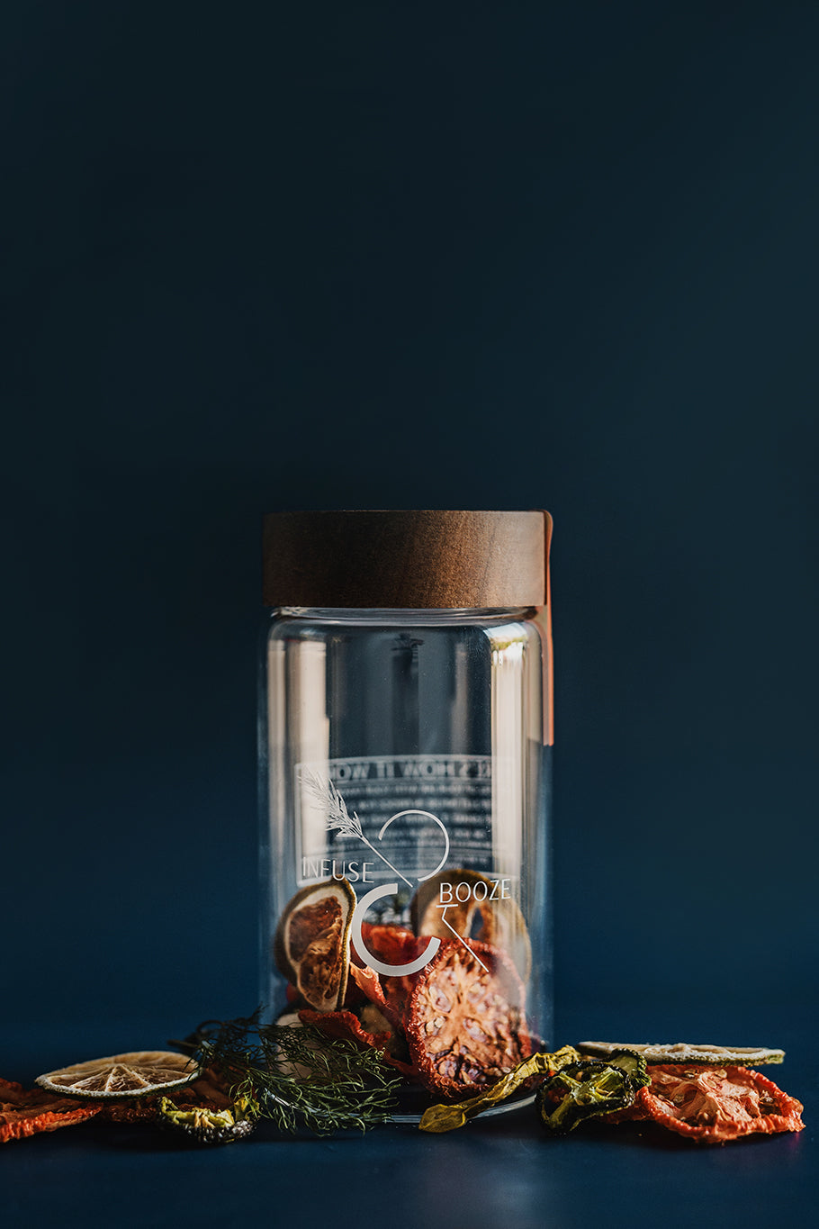 Clear glass jar with wooden lid on a dark background