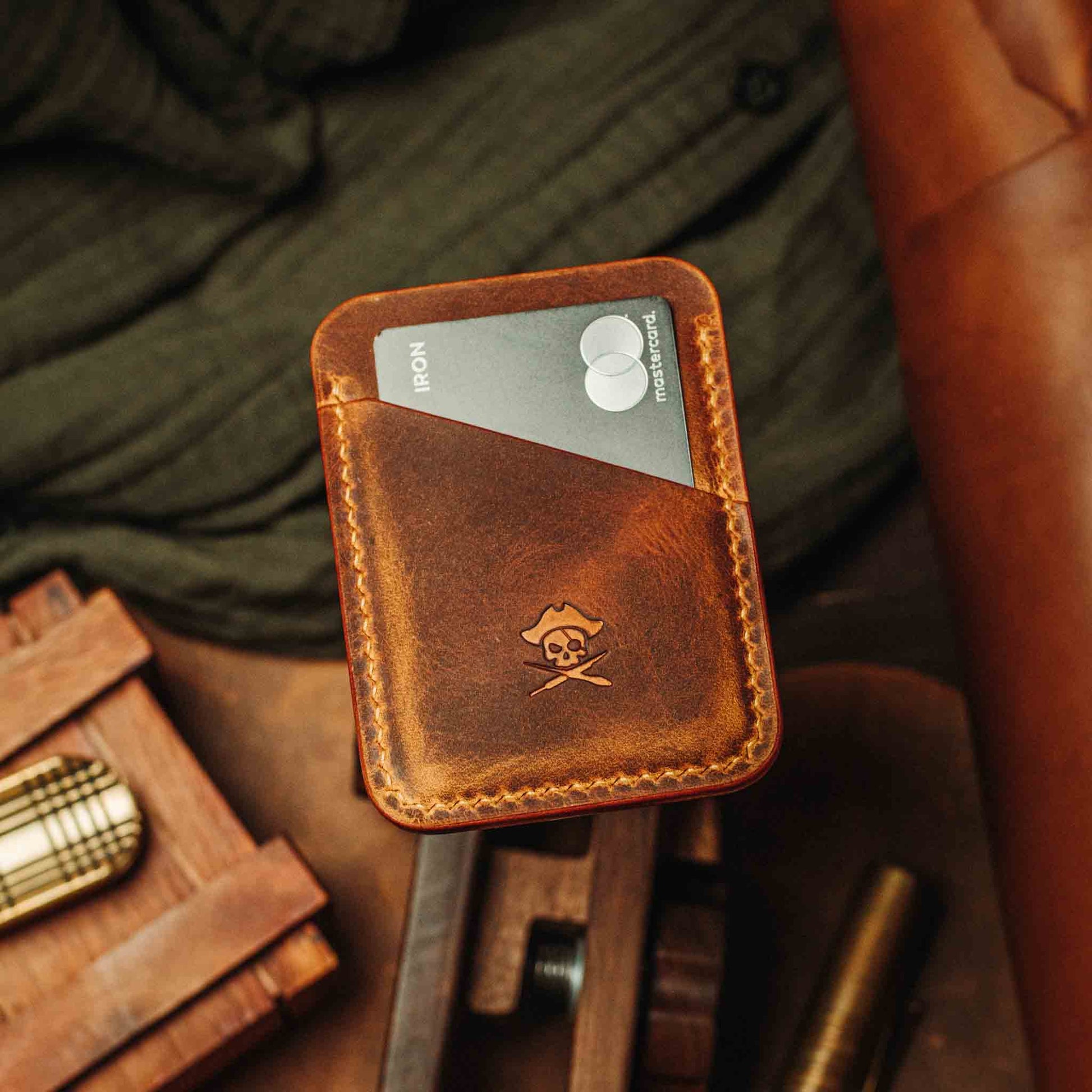 Brown leather wallet with card holder on a wooden surface