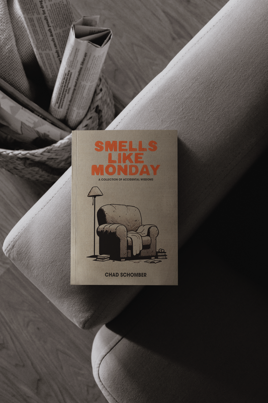 Smells Like Monday book on the armrest of a sofa. 