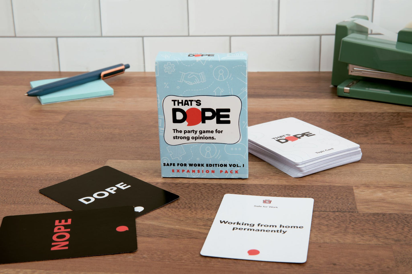 Dope party game cards and packaging on a wooden table
