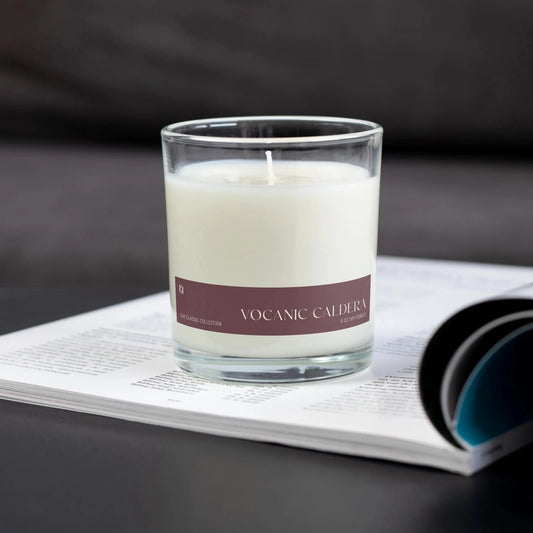 Candle with a purple label on an open magazine
