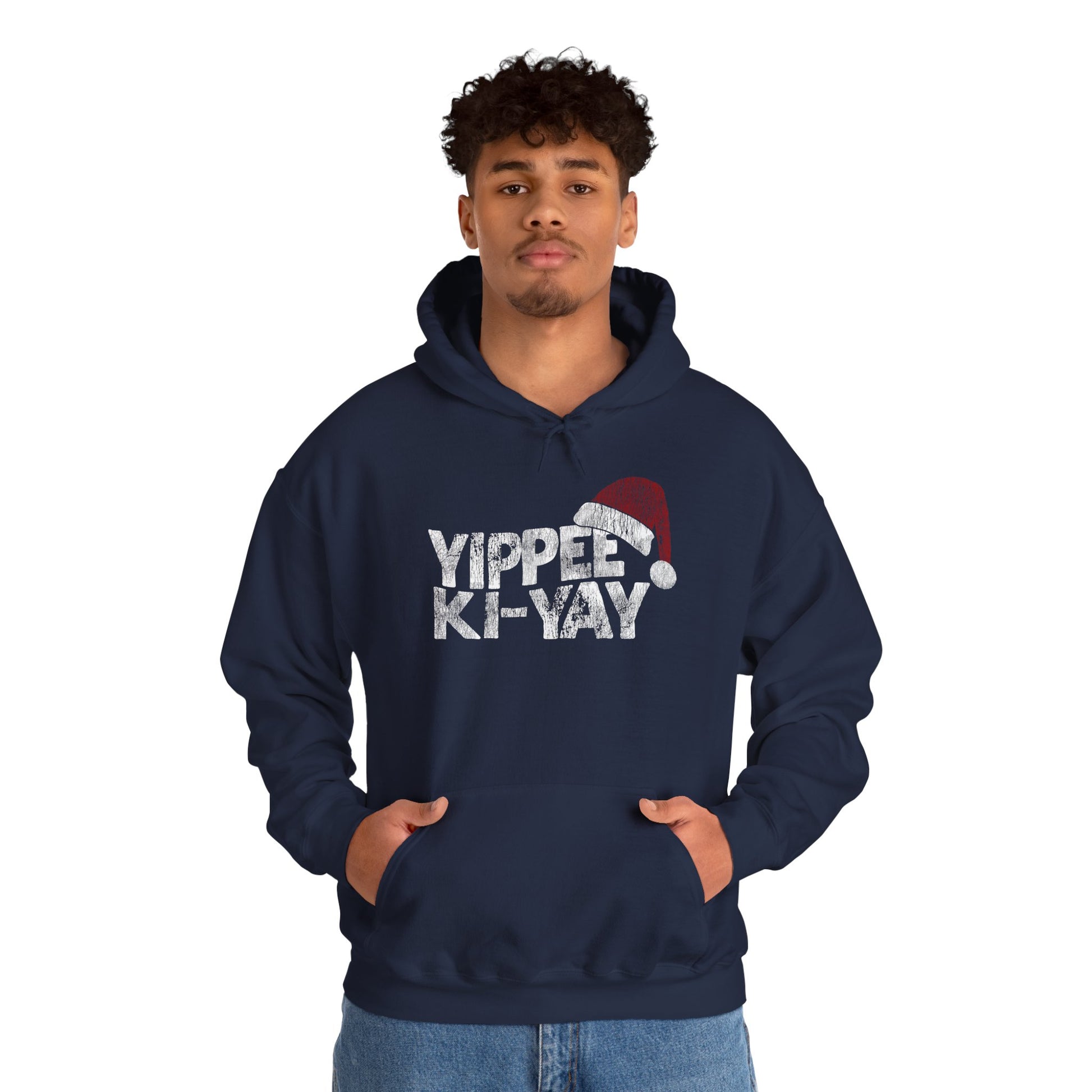 Person wearing a navy hoodie with 'Yippee Ki-Yay' text and Santa hat graphic on a white background