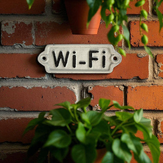 Wi-Fi sign on a brick wall with plants around